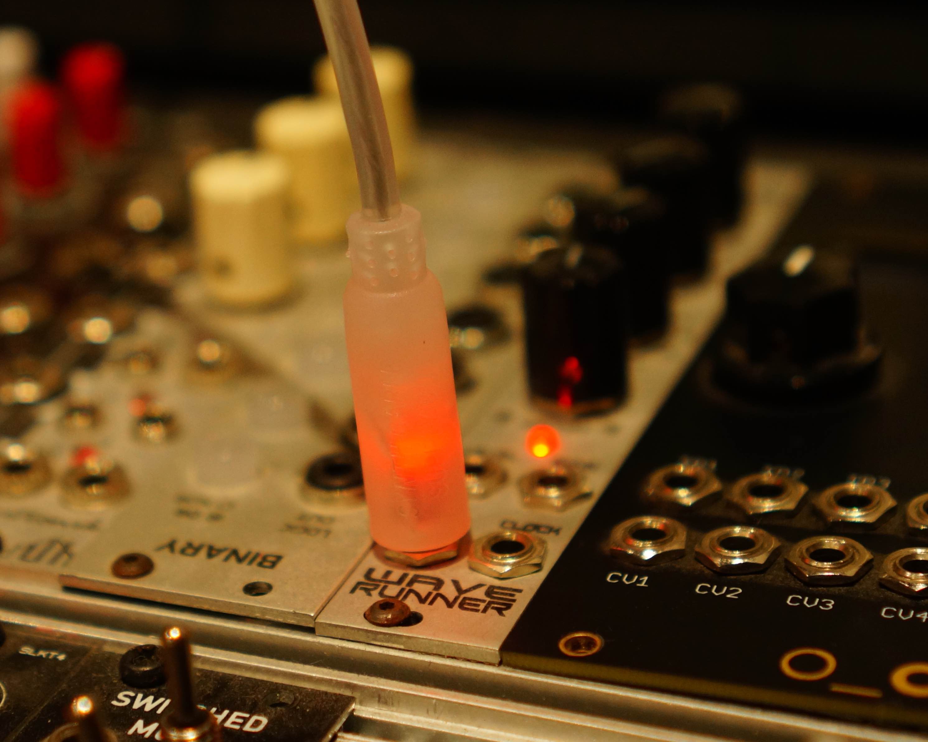 Red bi-polar modular synth LED light up patch cable